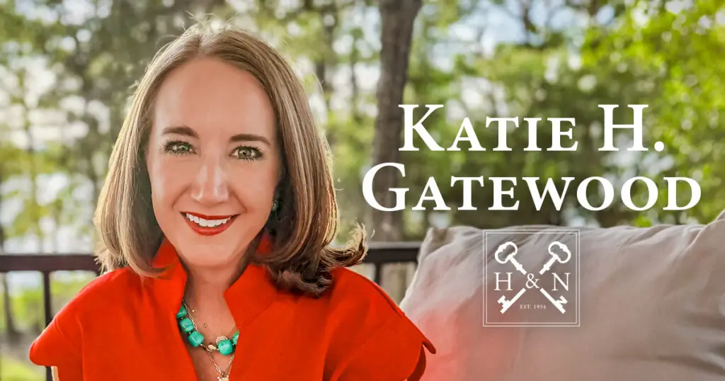 Katie Gatewood sits on a cushioned outdoor porch swing in front of a blurred nature background